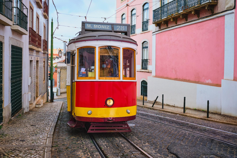 Lisbon in January – mild and uncrowded Yellow vintage tram 28 on a Lisbon street