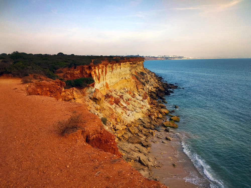 Sea cliffs and golden beach in Portugal's Algarve