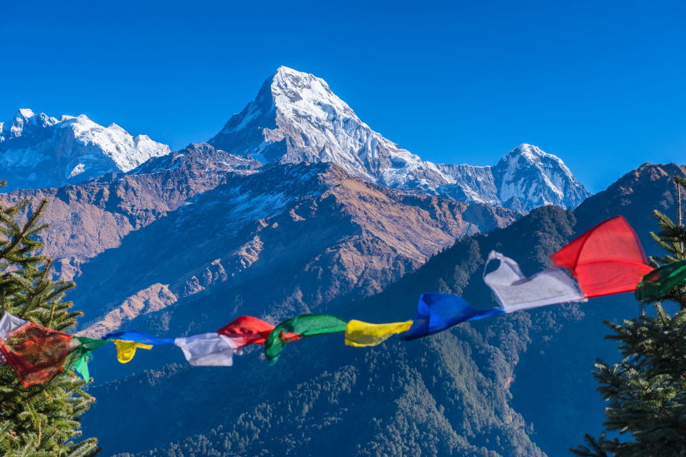Snow-covered Himalayan mountains and prayer flags in Nepal