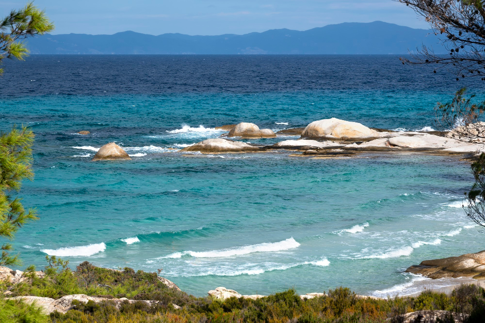 Greek island with white buildings and blue sea