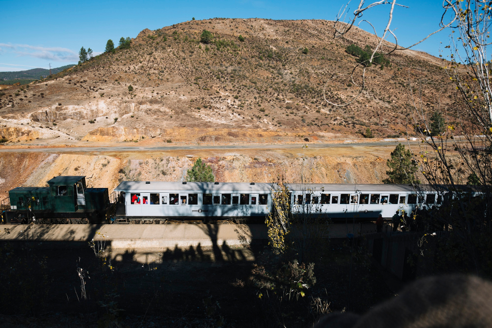 The Belmond Hiram Bingham luxury train moving through Peru's Sacred Valley toward Machu Picchu