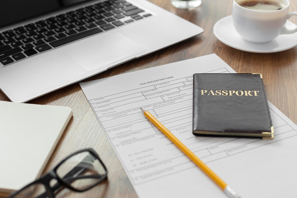 Open passport with visa stamps and travel insurance papers