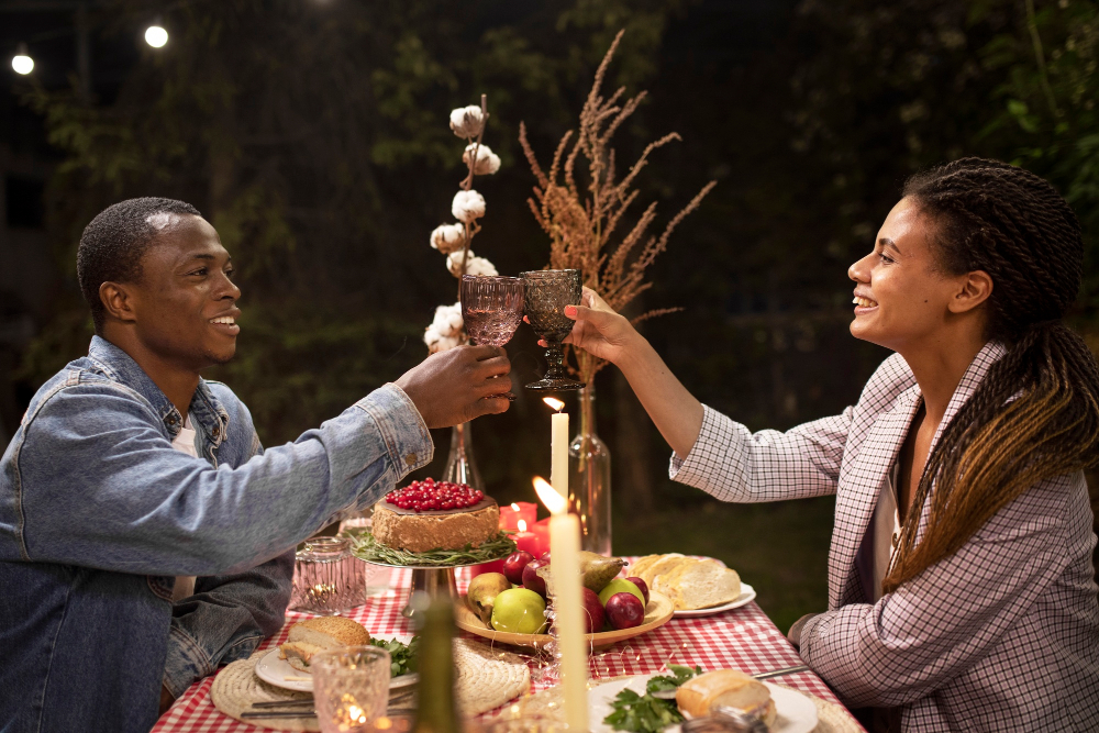 Candlelit beach dinner setup at dusk, private beach Philippines, two place settings, lanterns on sand