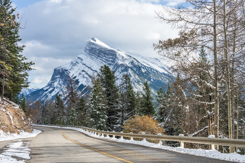 Banff in January – pristine snow and crisp air Snow-covered mountains and frozen lake in Banff