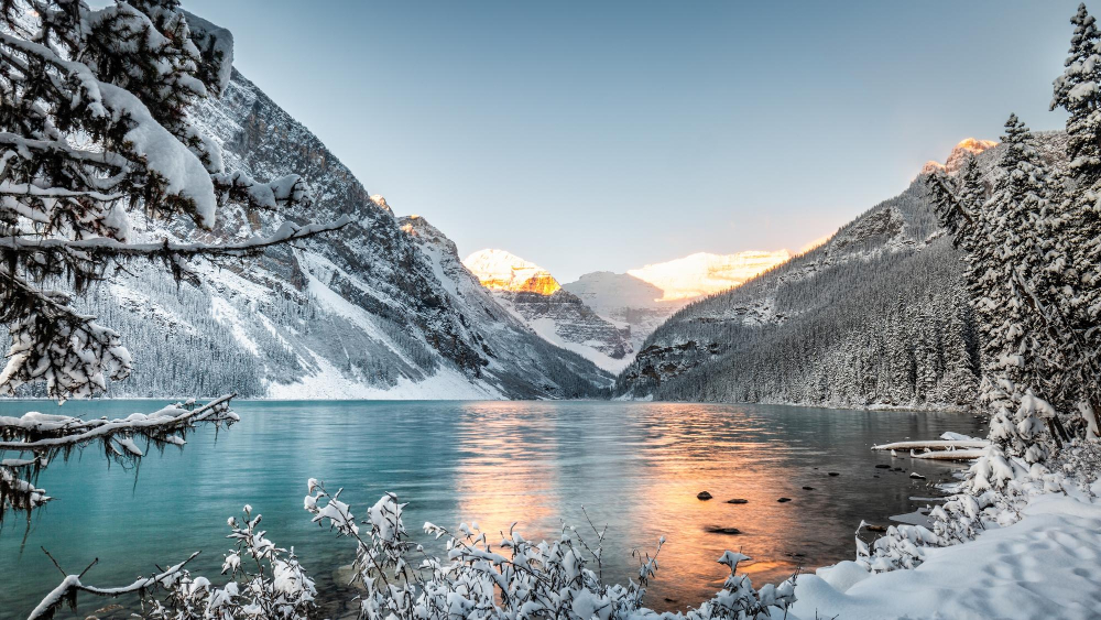 Frozen Lake Louise with snow-covered mountains