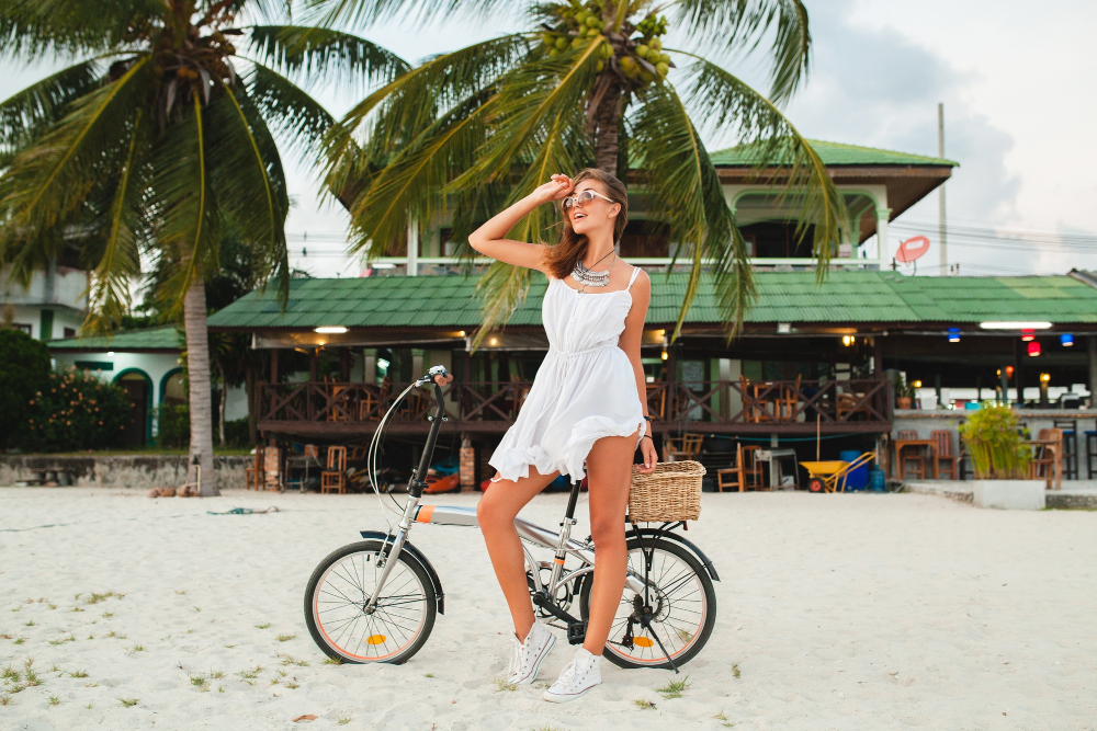 General Luna Siargao café street with palm trees, design boutique hotel exterior and bicycle visible, early morning light
