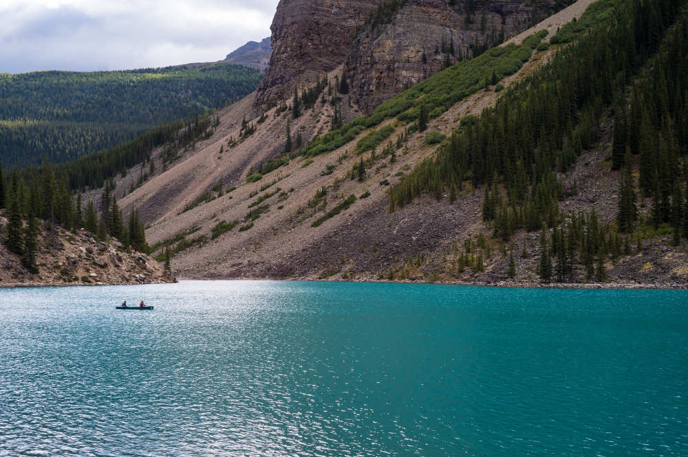 Banff in June Turquoise Lake Louise with mountains and canoe