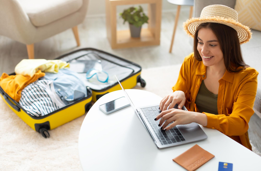 Airplane boarding pass, smartphone with flight confirmation, souvenir photos