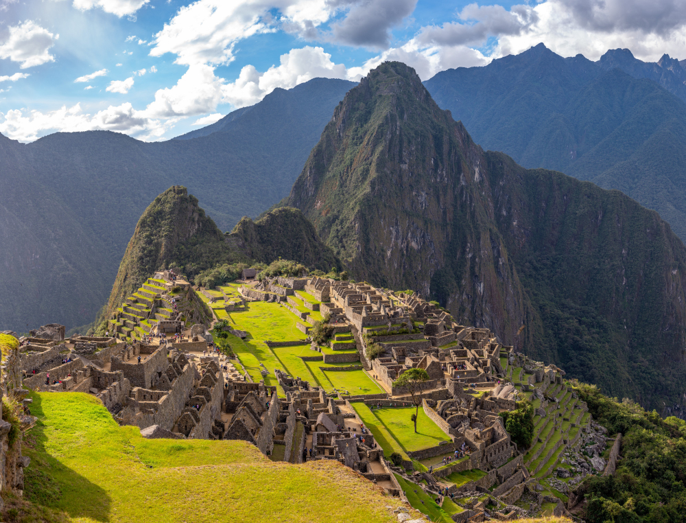 Machu Picchu in June Machu Picchu ruins with dramatic mountains and clear blue sky