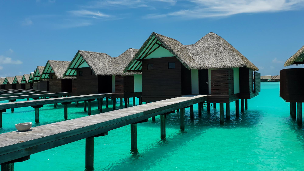 Maldives dry season Overwater villas in Maldives with turquoise lagoon