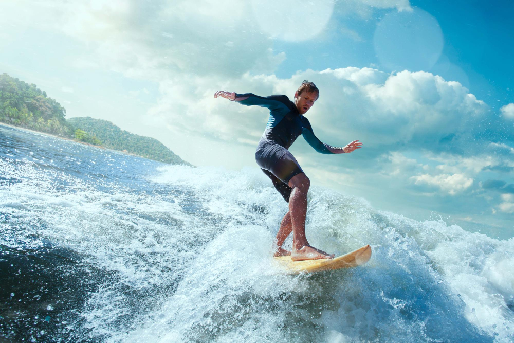 Surfer at Cloud 9 boardwalk with wave in background, September conditions