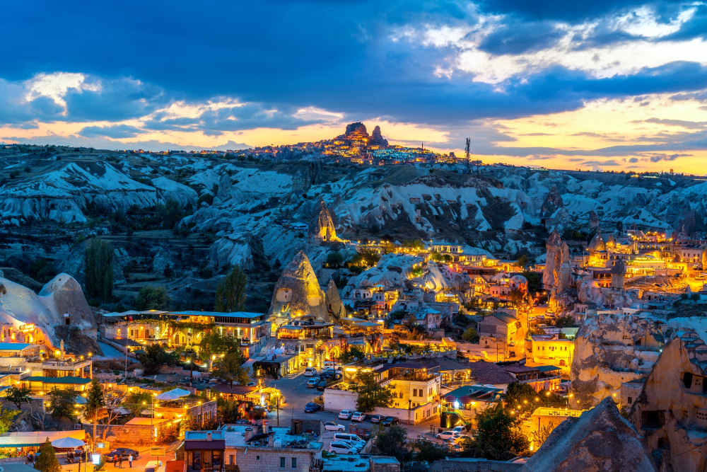 Hot air balloons over snow-dusted Cappadocia fairy chimneys