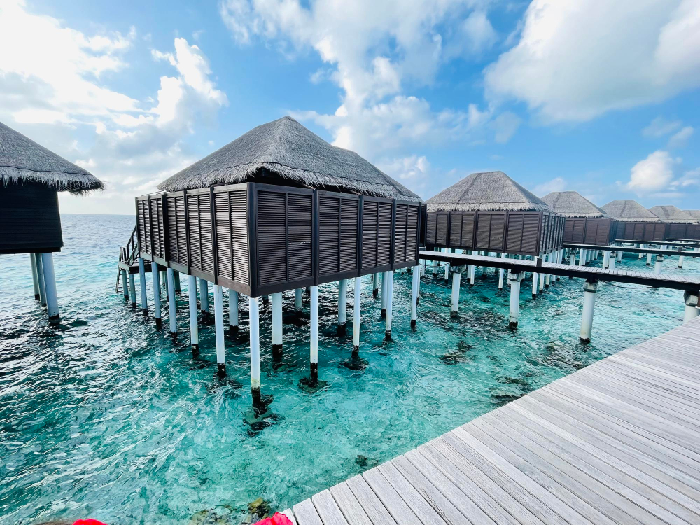 Luxury overwater villa with glass floor and ocean view