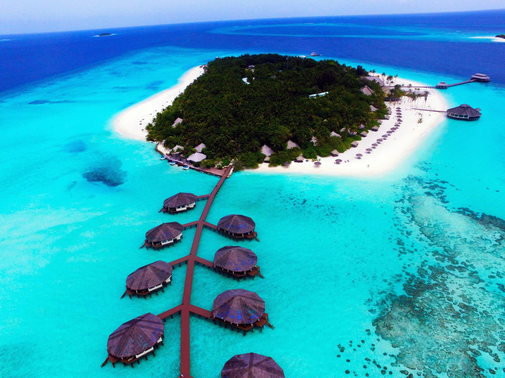 Traditional dhoni boat near a tropical island